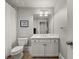 Cozy bathroom featuring a white vanity with ample storage and modern fixtures at 1904 Woodland Hills Nw Ave, Atlanta, GA 30318