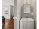 Well-lit half bathroom featuring a white vanity, sink, and medicine cabinet at 1904 Woodland Hills Nw Ave, Atlanta, GA 30318