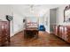 Bright bedroom featuring hardwood floors, ceiling fan, and a sitting area, perfect for relaxing at 1904 Woodland Hills Nw Ave, Atlanta, GA 30318