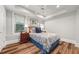 Comfortable bedroom with laminate wood flooring, natural light, and stylish furnishings at 1904 Woodland Hills Nw Ave, Atlanta, GA 30318