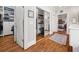 Hallway featuring closet, mirrors, and door that leads to bedroom, creating an airy space at 1904 Woodland Hills Nw Ave, Atlanta, GA 30318