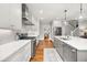 Bright, spacious kitchen featuring a center island, stainless steel appliances, and white cabinets at 1904 Woodland Hills Nw Ave, Atlanta, GA 30318