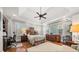 Spacious main bedroom with tray ceiling, hardwood floors, and ample natural light at 1904 Woodland Hills Nw Ave, Atlanta, GA 30318