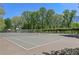 Well-maintained tennis and basketball courts surrounded by mature trees, perfect for recreation at 1904 Woodland Hills Nw Ave, Atlanta, GA 30318