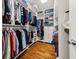 Organized walk-in closet with custom shelving and hanging rods maximizing storage space at 1904 Woodland Hills Nw Ave, Atlanta, GA 30318