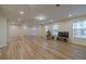 Bright and open finished basement with hardwood flooring and recessed lighting at 3365 Preservation Cir, Lilburn, GA 30047