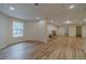 Basement area features recessed lights, wood floors, and windows, offering customizable space at 3365 Preservation Cir, Lilburn, GA 30047
