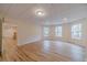Finished basement with multiple windows and hardwood flooring at 3365 Preservation Cir, Lilburn, GA 30047
