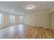 Spacious basement area with wood floors, recessed lighting, and storage closets; ready for customization at 3365 Preservation Cir, Lilburn, GA 30047