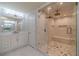 Modern bathroom with dual sinks, tiled floors, and glass enclosed shower at 3365 Preservation Cir, Lilburn, GA 30047