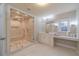 Modern bathroom boasts a glass enclosed shower with rainfall head and seating at 3365 Preservation Cir, Lilburn, GA 30047