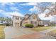 Spacious two-story home featuring a three-car garage and well-maintained lawn, highlighting comfortable suburban living at 3365 Preservation Cir, Lilburn, GA 30047