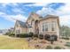 Attractive two-story residence with professionally landscaped front yard, showcasing quality and attention to detail at 3365 Preservation Cir, Lilburn, GA 30047