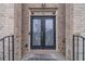 Inviting home entryway featuring double doors with decorative glass inserts and a 'Welcome' mat at 3365 Preservation Cir, Lilburn, GA 30047