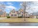 Charming two-story brick home with manicured landscaping, creating a welcoming and picturesque curb appeal at 3365 Preservation Cir, Lilburn, GA 30047