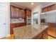 A kitchen with granite countertops, stainless appliances, and beautiful hardwood flooring at 3365 Preservation Cir, Lilburn, GA 30047