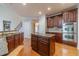 Well-equipped kitchen with wood cabinets, stainless steel appliances, and granite countertops at 3365 Preservation Cir, Lilburn, GA 30047