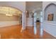 Spacious living room featuring hardwood floors, columns, and a staircase at 3365 Preservation Cir, Lilburn, GA 30047