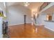 Spacious living area featuring hardwood floors, a staircase, and plenty of natural light at 3365 Preservation Cir, Lilburn, GA 30047