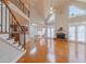 Bright living room with fireplace, high ceilings, large windows, and hardwood floors at 3365 Preservation Cir, Lilburn, GA 30047