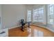 Bright home office with large windows and hardwood floors at 3365 Preservation Cir, Lilburn, GA 30047