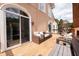 Relaxing back porch with outdoor seating and decorative swing at 5360 Brooke Ridge Dr, Dunwoody, GA 30338