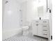 Bright bathroom featuring white subway tile, stylish black and white mosaic flooring, and updated vanity at 5360 Brooke Ridge Dr, Dunwoody, GA 30338