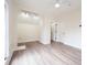 View of bedroom featuring a ceiling fan, neutral walls, and light-colored laminated wood flooring at 5360 Brooke Ridge Dr, Dunwoody, GA 30338