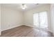 Bright bedroom with large window and a ceiling fan at 5360 Brooke Ridge Dr, Dunwoody, GA 30338