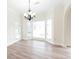 Well-lit dining area featuring bay windows and a modern chandelier at 5360 Brooke Ridge Dr, Dunwoody, GA 30338