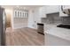 Modern kitchen featuring stainless steel appliances and a gas cooktop at 5360 Brooke Ridge Dr, Dunwoody, GA 30338
