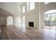 Bright living room with a fireplace and large windows to view the deck at 5360 Brooke Ridge Dr, Dunwoody, GA 30338