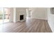 Spacious living room with fireplace, hardwood floors, and sliding door access to the deck at 5360 Brooke Ridge Dr, Dunwoody, GA 30338