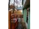 Backyard features a wooden deck, a green-painted exterior wall and a wood fence in the distance at 1034 Bettina Ct, Mableton, GA 30126