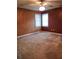 Bedroom with neutral carpet, painted accent walls, and windows with blinds at 1034 Bettina Ct, Mableton, GA 30126