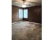 Bedroom with carpet, neutral trim, painted brown accent walls, and windows with blinds at 1034 Bettina Ct, Mableton, GA 30126