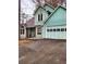 Exterior view of a two-story home with an attached garage and asphalt driveway at 1034 Bettina Ct, Mableton, GA 30126