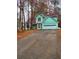 Exterior view of a two-story home with an attached garage and asphalt driveway at 1034 Bettina Ct, Mableton, GA 30126