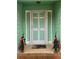 Charming front door with seasonal decor and painted in light green at 1034 Bettina Ct, Mableton, GA 30126