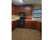 Kitchen with countertops, stainless sink and black appliances at 1034 Bettina Ct, Mableton, GA 30126