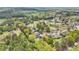 Aerial view of the community featuring a mix of homes, lush trees, and landscaping at 105 Oakfield Way, Douglasville, GA 30134