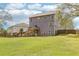 Spacious backyard featuring a well-manicured lawn and a wooden deck for outdoor entertaining at 105 Oakfield Way, Douglasville, GA 30134