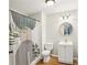 A clean bathroom features a shower and a vanity with storage at 105 Oakfield Way, Douglasville, GA 30134