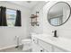 Charming bathroom featuring a modern vanity and industrial style shelves at 105 Oakfield Way, Douglasville, GA 30134