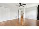 Spacious bedroom with wood floors and a ceiling fan at 105 Oakfield Way, Douglasville, GA 30134