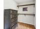 Walk in closet with built in wood shelving and wood look flooring at 105 Oakfield Way, Douglasville, GA 30134