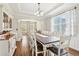 Charming dining room with a spacious table, tray ceilings, and a view to the living room at 105 Oakfield Way, Douglasville, GA 30134
