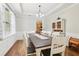Elegant dining room with large table, decorative china cabinet, and abundant natural light at 105 Oakfield Way, Douglasville, GA 30134