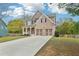 Attractive home with a two-car garage, brick accents, and a cozy front porch at 105 Oakfield Way, Douglasville, GA 30134