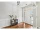 Elegant entryway with hardwood floors, wainscoting, and a stylish console table at 105 Oakfield Way, Douglasville, GA 30134